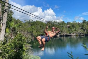 4 Private Cenotes, Zip-Lines, Canoes & Mayan Village with Delicious Lunch - Zip-lines in the jungle: views, speed, and safety with a local guide
