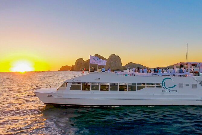 Cabo Sunset Dinner Cruise with Live Music & Open Bar on Cabo Wave - Stop 2: Playa de los Amantes—Sunset Watching From an Open-Air Deck