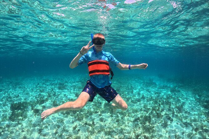 Cancun Catamaran: Isla Mujeres, Snorkeling, Drinks & Buffet Lunch - Crowd Energy and On-Board Photo Requests