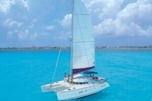 Cancun Half-Day Sailing Catamaran Cruise to Isla Mujeres - Isla Mujeres free time: beach energy, lunch at a beach club, and your own plan