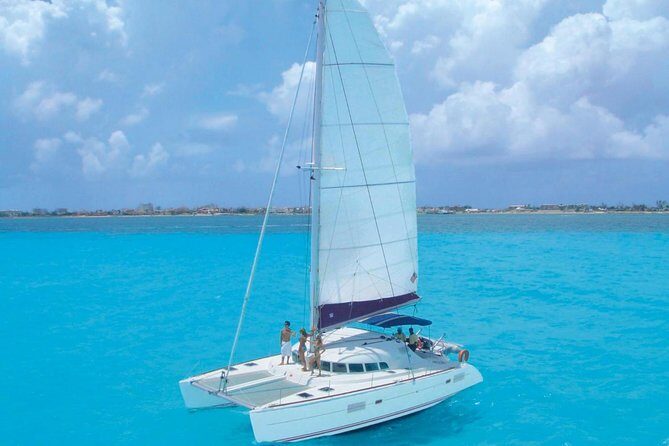 Cancun Half-Day Sailing Catamaran Cruise to Isla Mujeres - Isla Mujeres free time: beach energy, lunch at a beach club, and your own plan