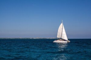 Cancun Sailing Catamaran Islas Mujeres With Luxury Beach Club - El Meco Reef snorkeling: short, timed, and weather dependent