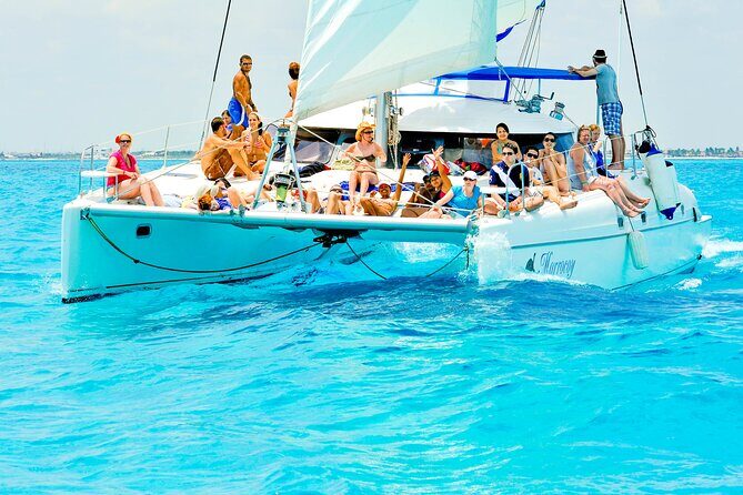 Catamaran to Isla Mujeres Snorkeling Tour with Open Bar and Lunch - Open bar, spinnaker, and the tempo of fun