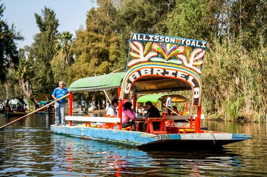 CDMX: Xochimilco, Coyoacan, Frida Kahlo Museum & Murals Tour - Xochimilco canals by trajinera: the classic CDMX experience