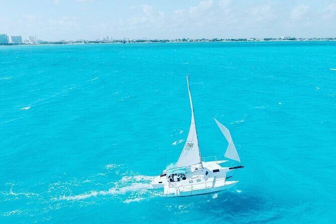 Exciting Catamaran Tour to Isla Mujeres, from Cancún! - Onboard Vibe: Drinks, Music, and the Crew’s Role in Your Day