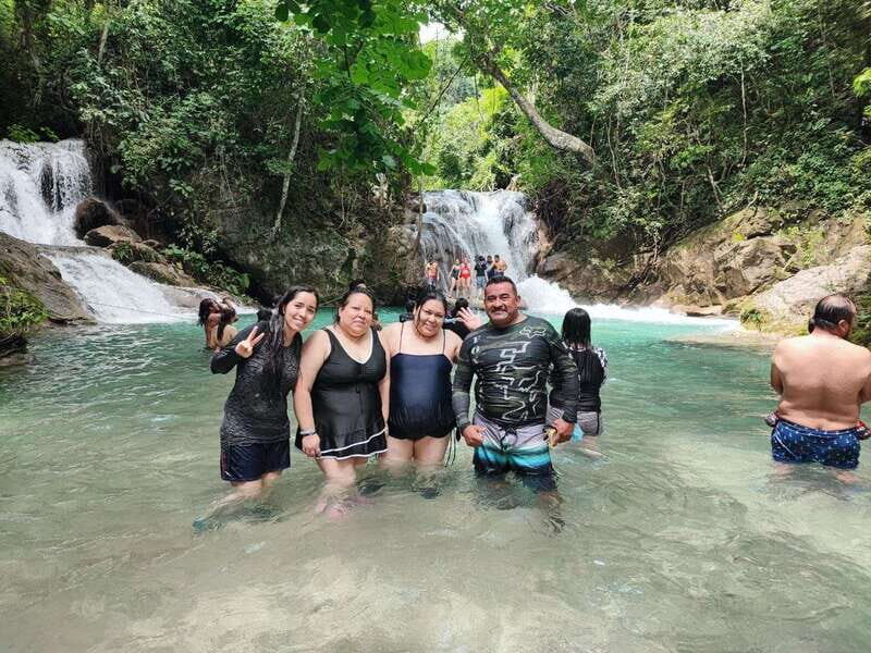From Huatulco: Magical Copalitilla Waterfalls with Entry - The community market stop: local products, mixed vibes