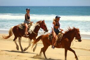 Horseback Riding Adventure in Playa Migriño with Tequila Tasting - Riding the rocky trail down to the sea sand