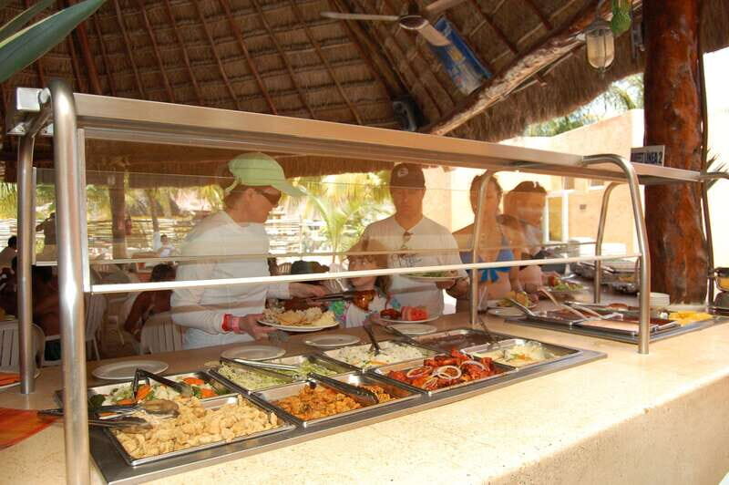 Isla Mujeres Catamaran, Snorkel & Buffet Lunch - Catamaran cruise vibe: music, drinks, and real party energy