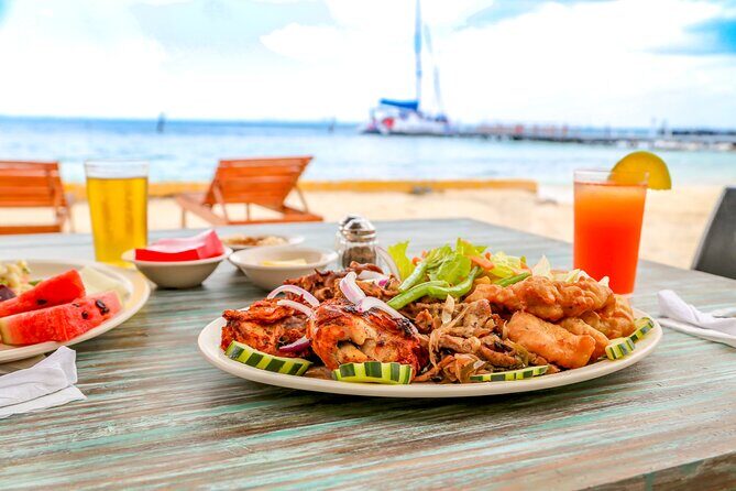 Isla Mujeres Catamaran Tour with Open Bar, Lunch and Snorkeling - Isla Mujeres beach club and lunch: where the day’s relaxed time really lives