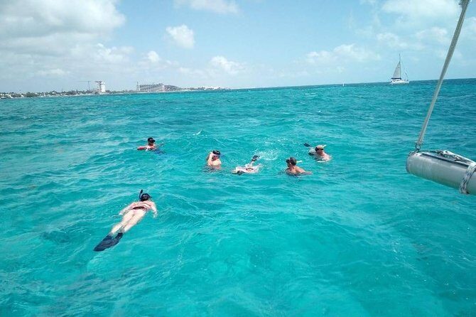Isla Mujeres Premium Catamaran Tour with transportation from Playa del Carmen - Boarding the Catamaran at 10:00: What the Boat Experience Feels Like