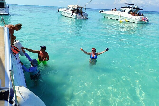Isla Mujeres Premium Tour in Private Catamaran with Lunch - Club Playa Mexico: Buffet Lunch, Showers, Lounge Chairs, and Cocktails