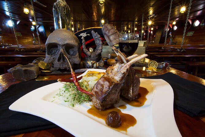 Jolly Roger Pirate Show and Dinner in Cancun - Dinner on the water: regular vs premium menus that actually make sense