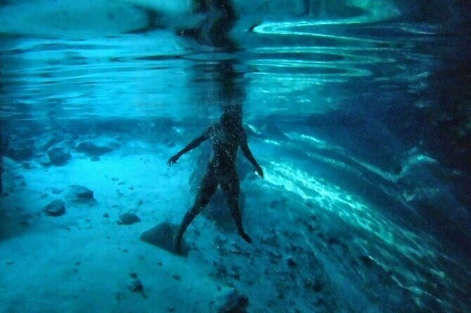 Jungle Bike Tour from Playa del Carmen with Bath in a Cenote - Arriving at the cenote cavern: crystal-clear water and jump-off options
