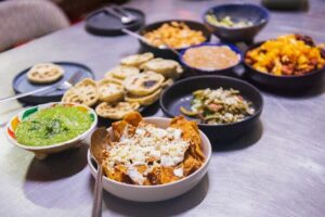 Learn How To Cook Mexican Food - What You’ll Cook: Sopes, Nopales Salad, Tinga, Papas con Chorizo, and Chilaquiles Rojos