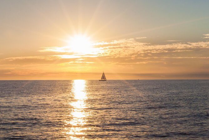 Los Cabos Luxury Sunset Sail with Light Appetizers and Open Bar - Boarding the 50-foot sailboat: what the first 45 minutes feel like