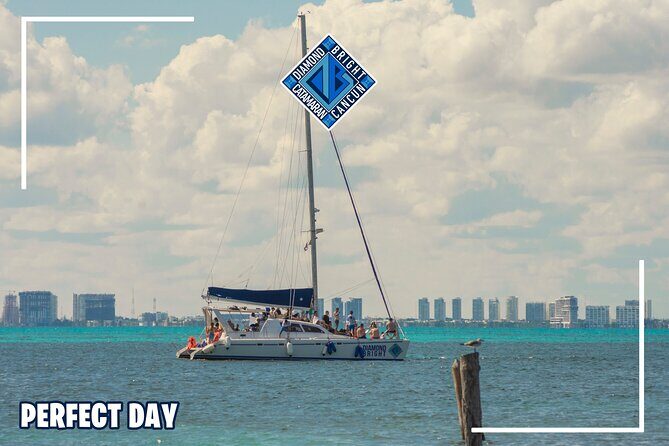 Luxury Catamaran tour to isla mujeres with transportation from Tulum - Spinnaker and the sunset cruise back to Cancún