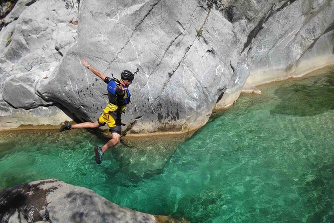 Matacanes : Canyoning + Hiking + Water Jumps + Rappel + Caves - Climbing, rappelling, and moving through tunnels