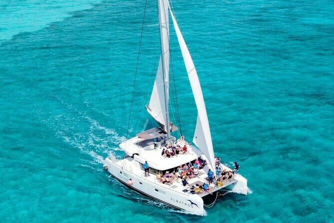 Plus Full Day Catamaran Tour to Isla Mujeres All Inclusive - Meeting the crew: guides and the vibe on the water