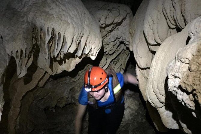 Private ATV Jungle & Cave Adventure - Entering the cave: flashlights, swimming gear, and an underground river feel