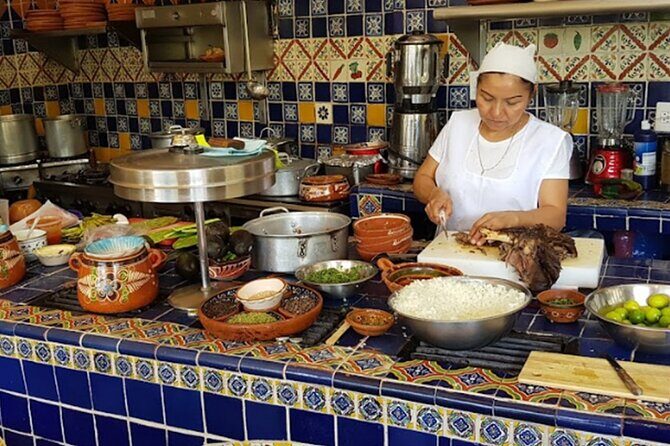 Private Cultural and Gastronomy Tour Full Day Tapatío - Nueve Esquinas breakfast: birria de chivo, tortillas on display, and coffee