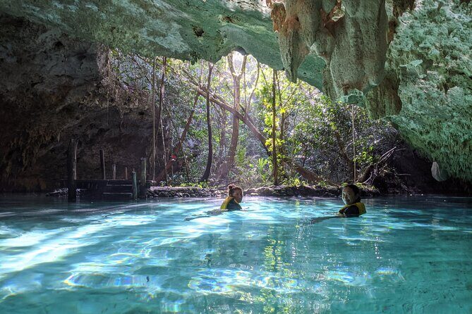 Private Guided Cenotes and Underground River Exploration - Stop 1: Cenotes Sac Actun sacred tree and underground river swim