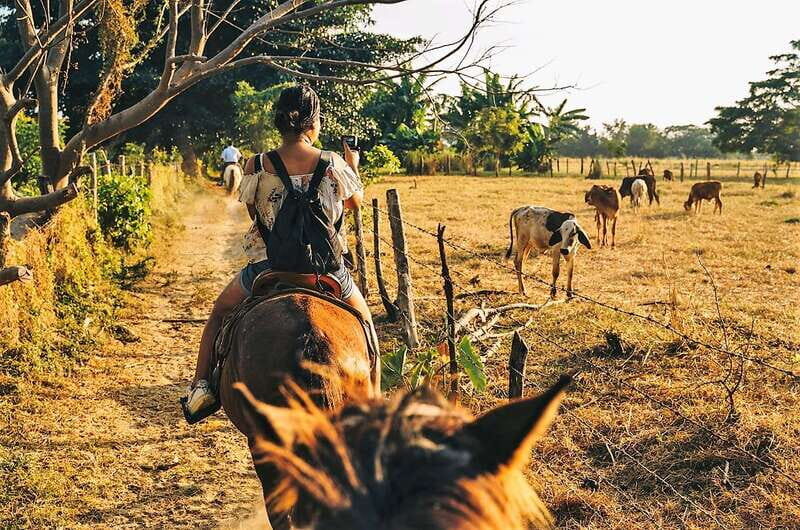 Puerto Escondido: Sunset Horse Back Riding Tour - Río del Maíz crossings and the boat ride where horses swim beside you