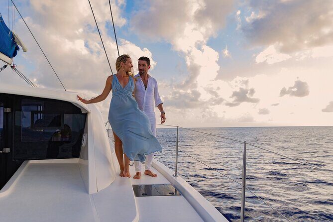 Riviera Maya Luxury Sunset Sailing plus Light Dinner and Open Bar - The sailing experience: jungle backdrop, Caribbean breezes, and a sunset behind land