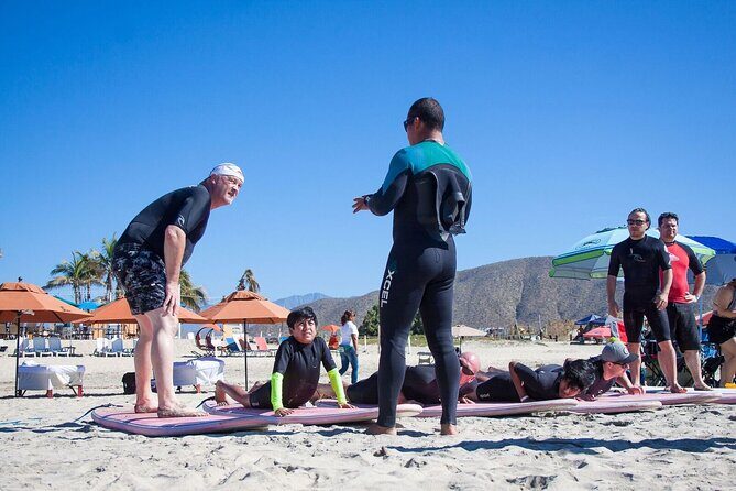 Surf Lessons at Cerritos - Equipment setup: foam boards, wetsuits, and rash-guard sizing