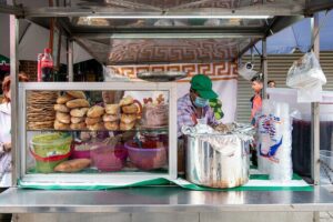 The Late Shift: Tasting Oaxaca, by Night - Tortas, beans in clay pots, and cacao at the night market edge