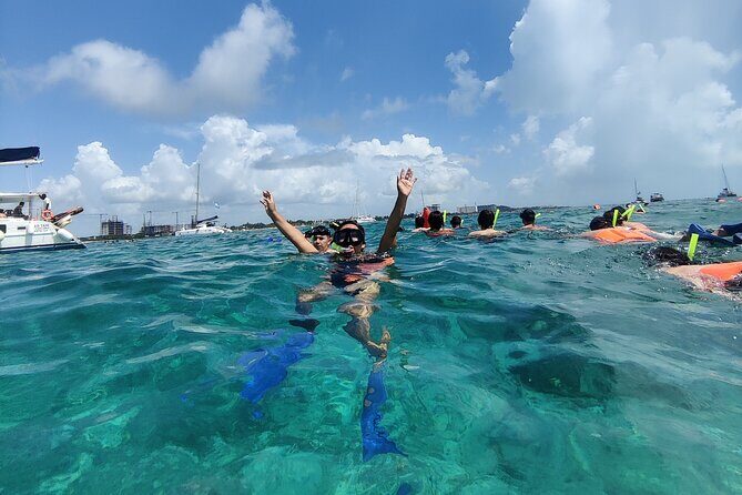 Top Isla Mujeres Catamaran Tour with Snorkel Open Bar and Buffet lunch - Price and the dock fee: the value math you should do first