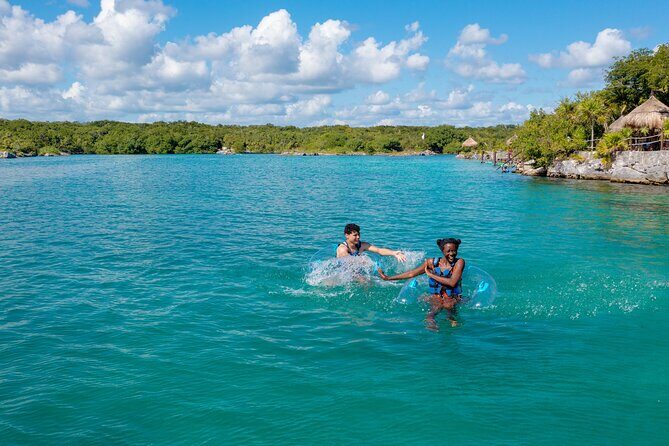 Xel-Ha Tickets with Transportation included - Caves, cenotes, floating bridge, and the hidden-beach stop